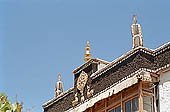 Ladakh - Sankar Gompa (Leh), projecting roofs in deep red 